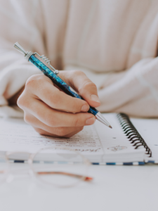 woman writing in planner