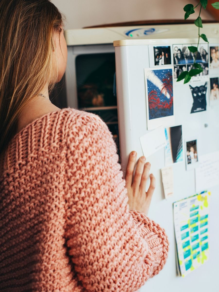 Woman looking into fridge